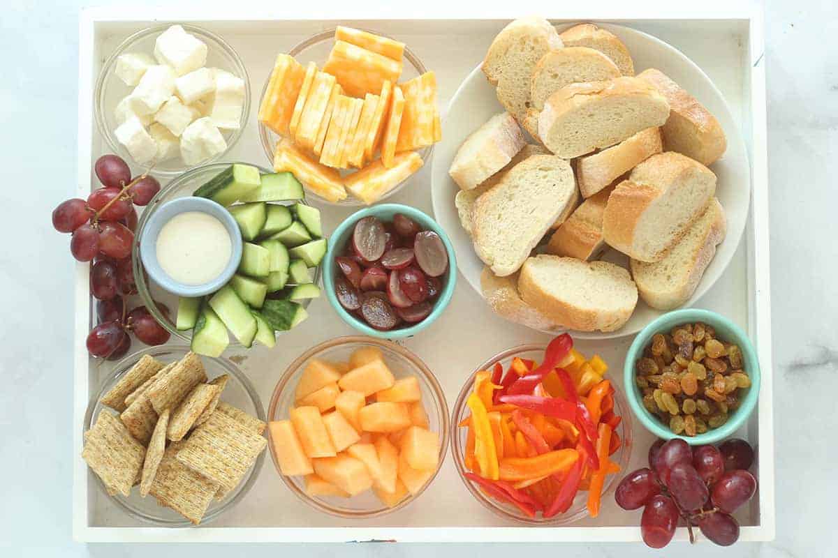 “Snack plate” of safe foods + one tiny new food (deconstructed charcuterie-style)
